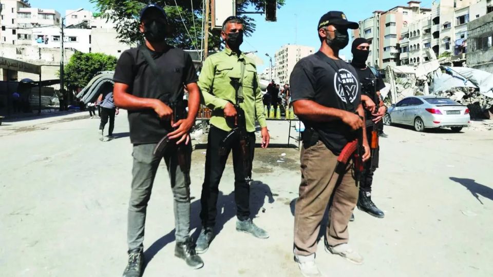 Hamas police officers patrol a street in Gaza City (Reuters) Hamas police officers patrol a street in Gaza City (Reuters)